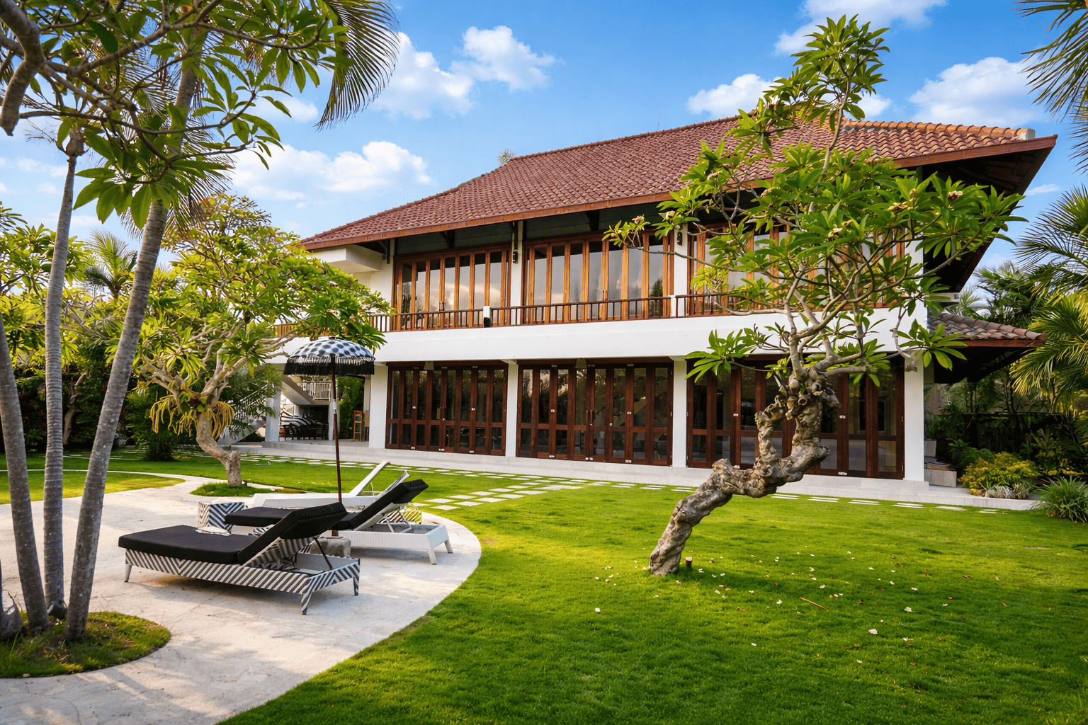 Balinese villa with sun loungers balipropertyagent.com